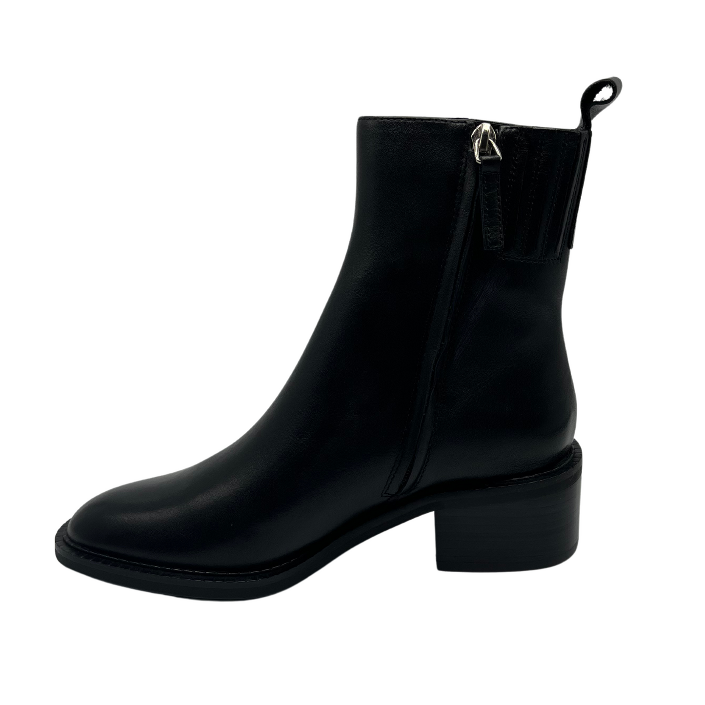 Left facing view of black leather short ankle boots, short block heel and pull on heel tab