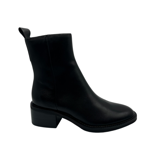 Right facing view of black leather short ankle boots, short block heel and pull on heel tab