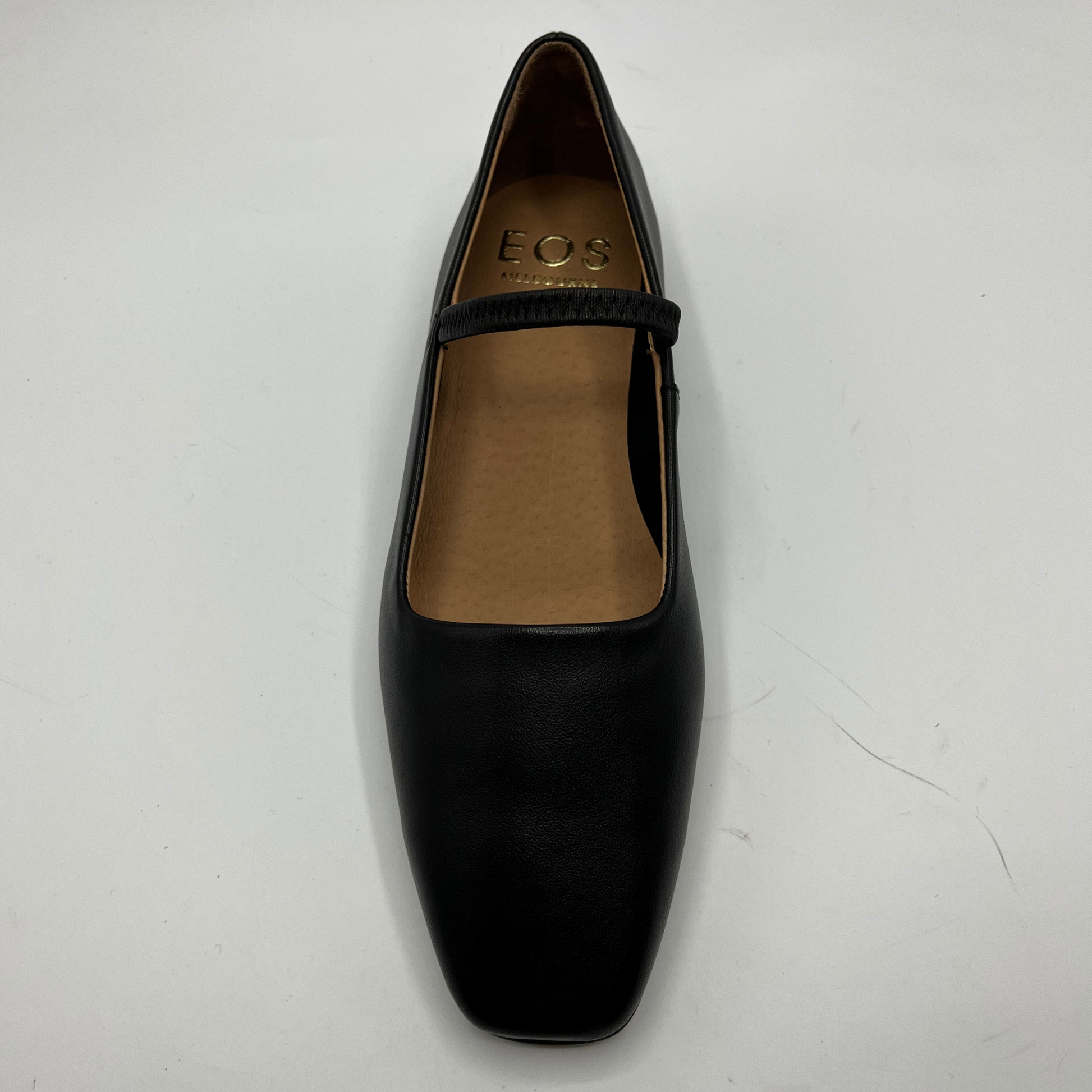 Black shoe with a brand logo on a white background