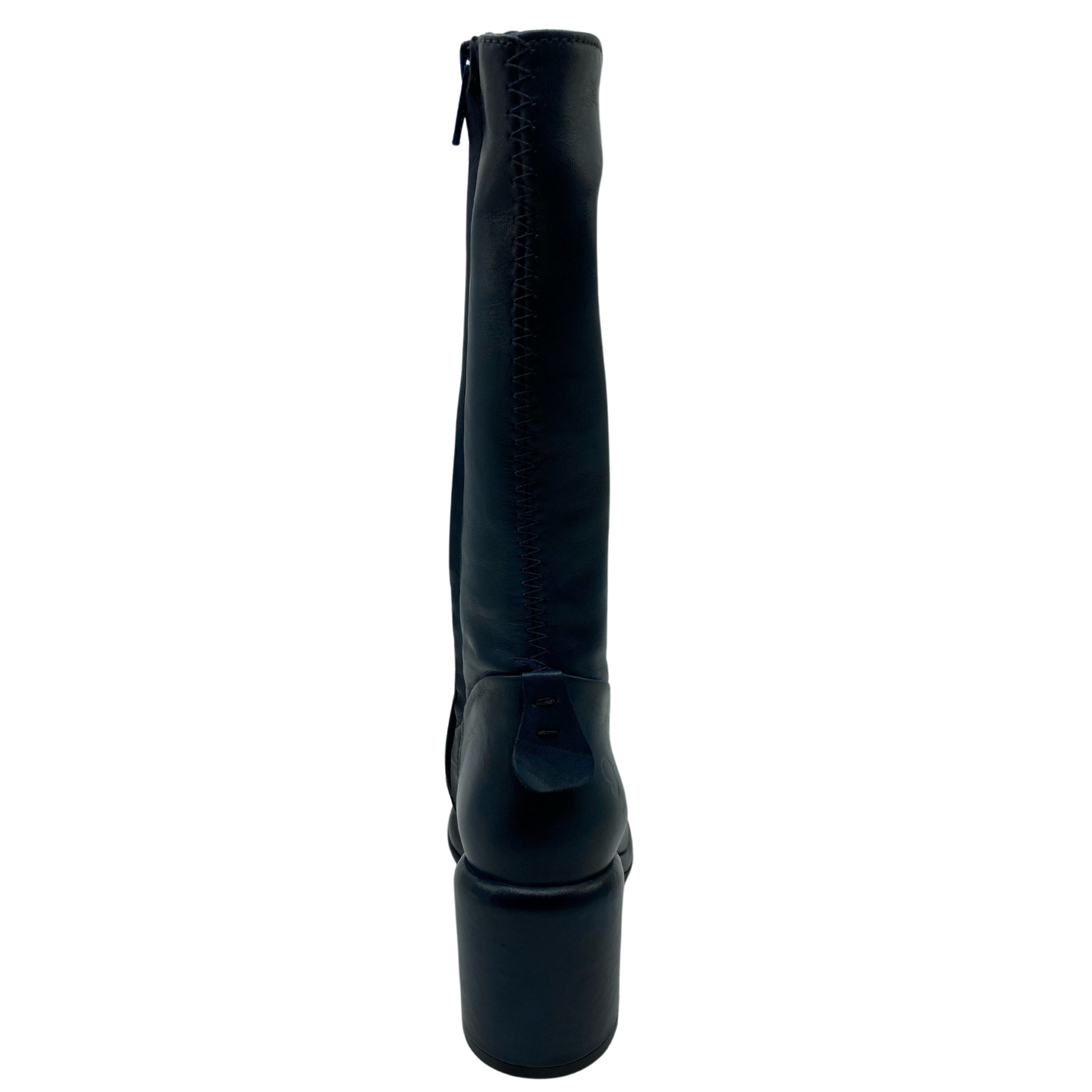 Hind view of tall leather boot with chunky heel and zipper closure up the shaft