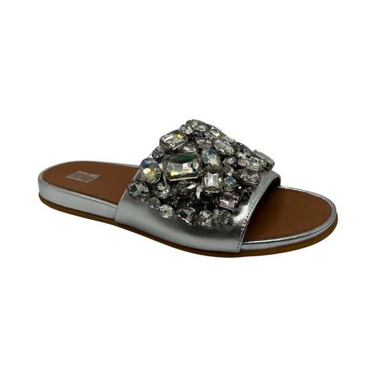 45 degree angled view of silver slip on sandal with jewel embellishments and open toe