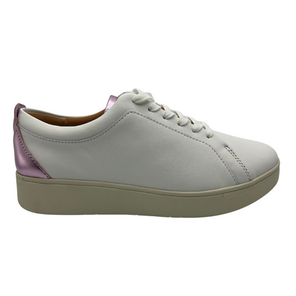 Right facing view of white leather sneakers with white laces, rubber outsole and metallic lilac detail on heel