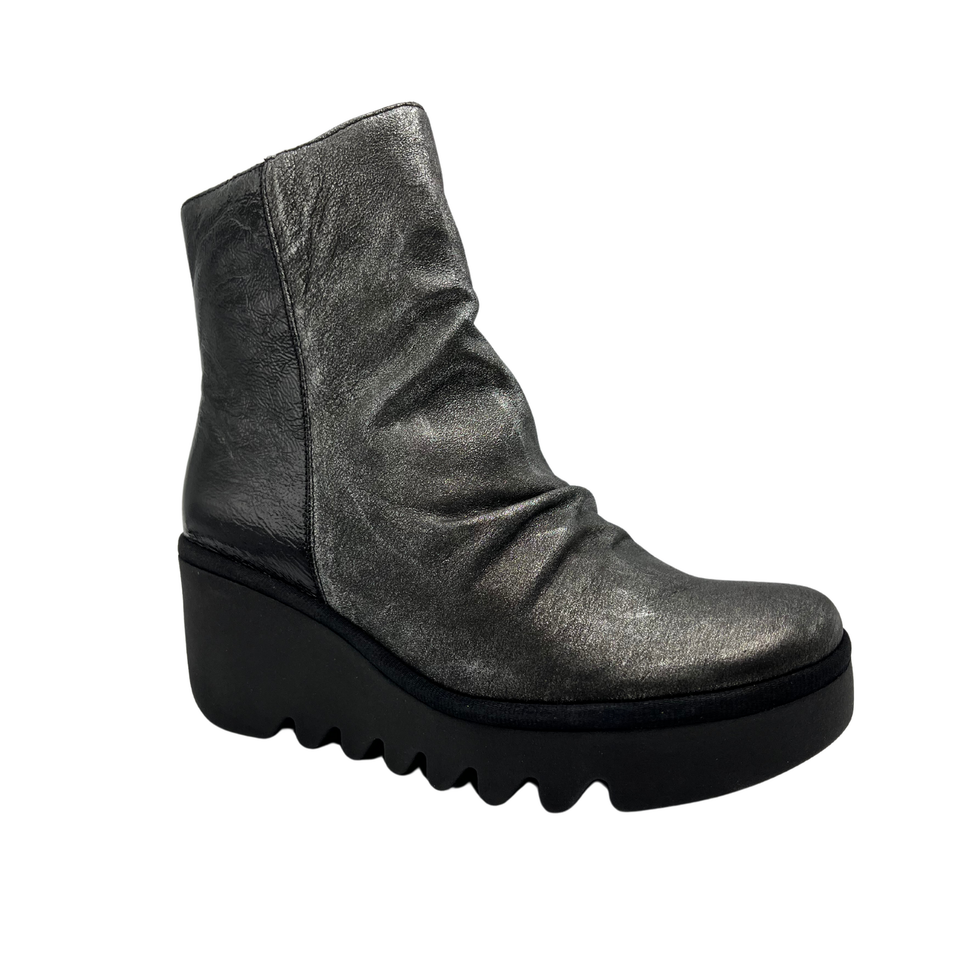 45 degree angled view of dark silver leather bootie with wedge heel and side zipper closure