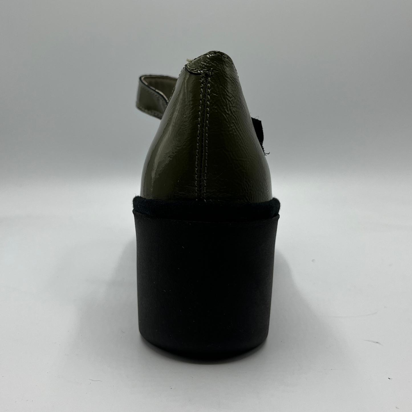 Black sandal with a thick sole on a white background