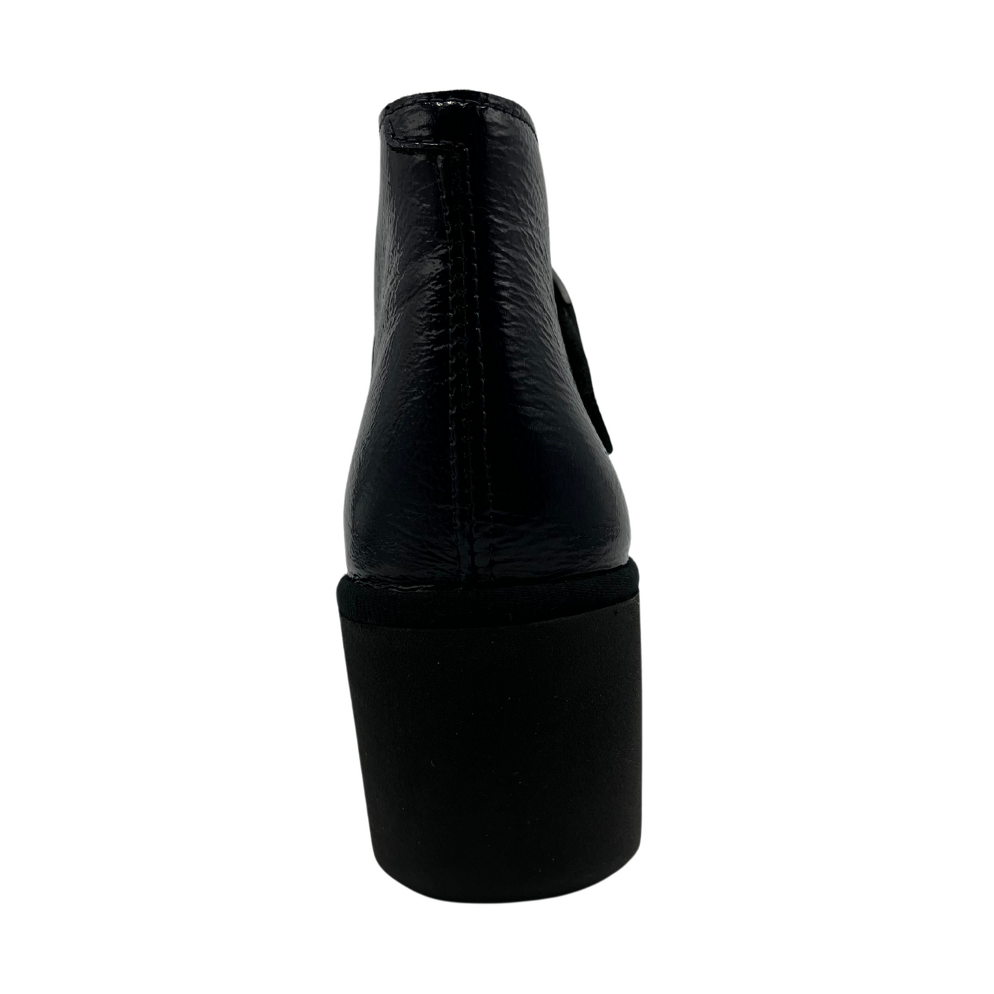 Back view navy patent leather wedge ankle boot with buckle strap and black outsole
