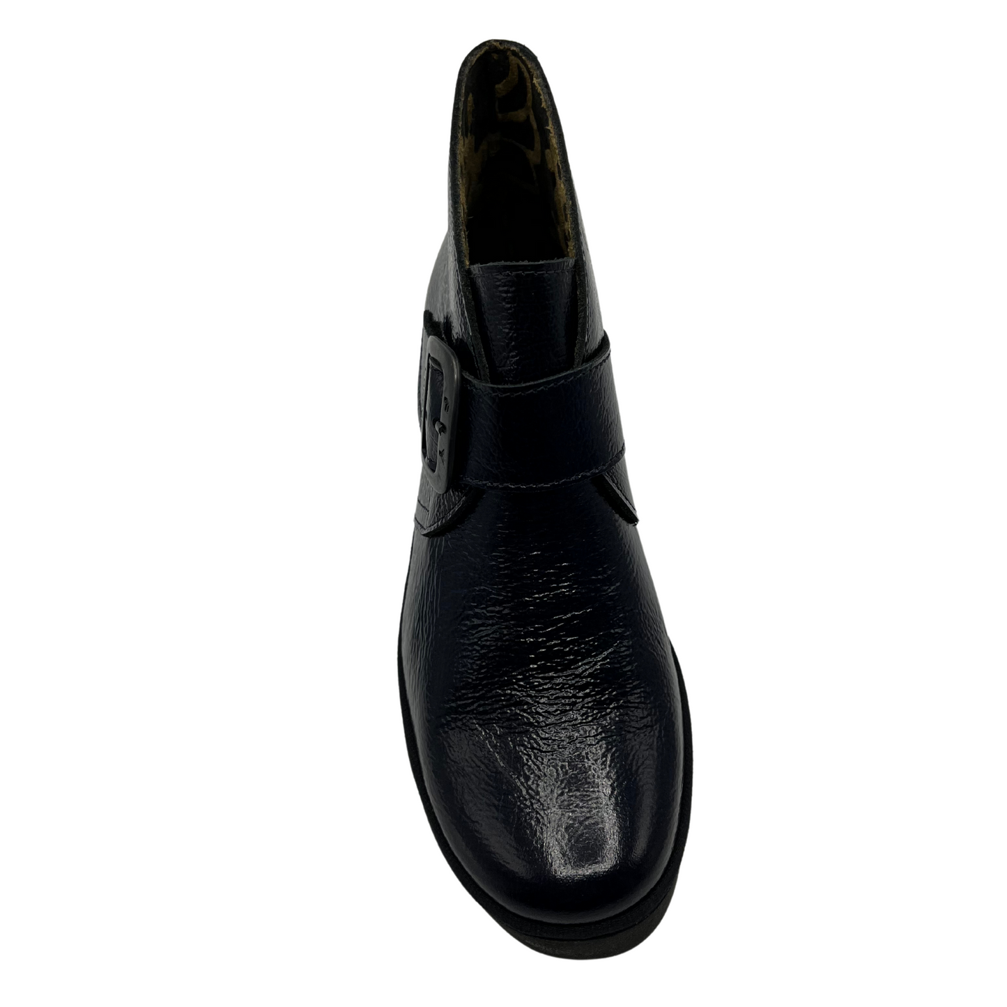Top view navy patent leather wedge ankle boot with buckle strap and black outsole