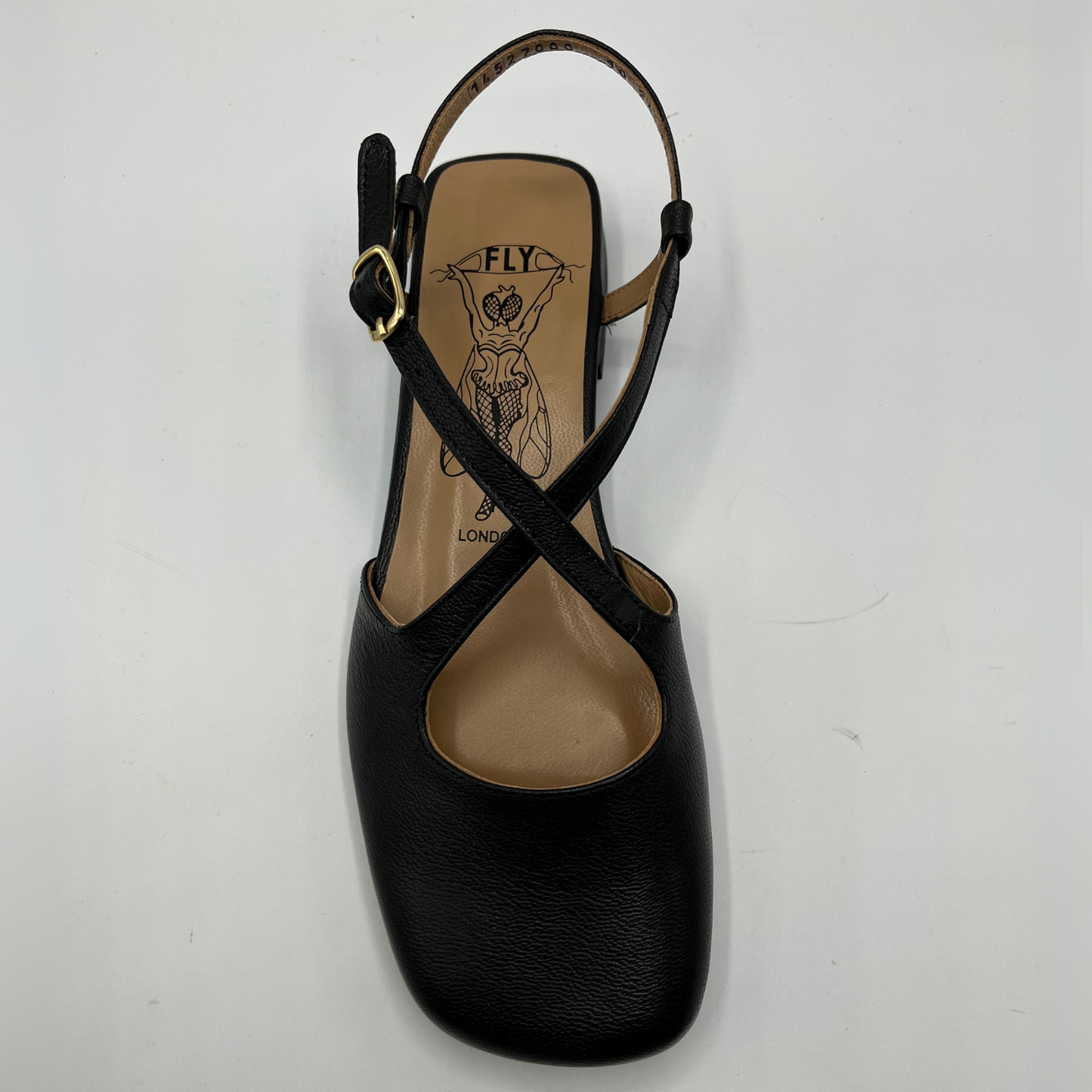 Top view of a black leather sandal with a closed toe, an adjustable ankle strap and a low heel.