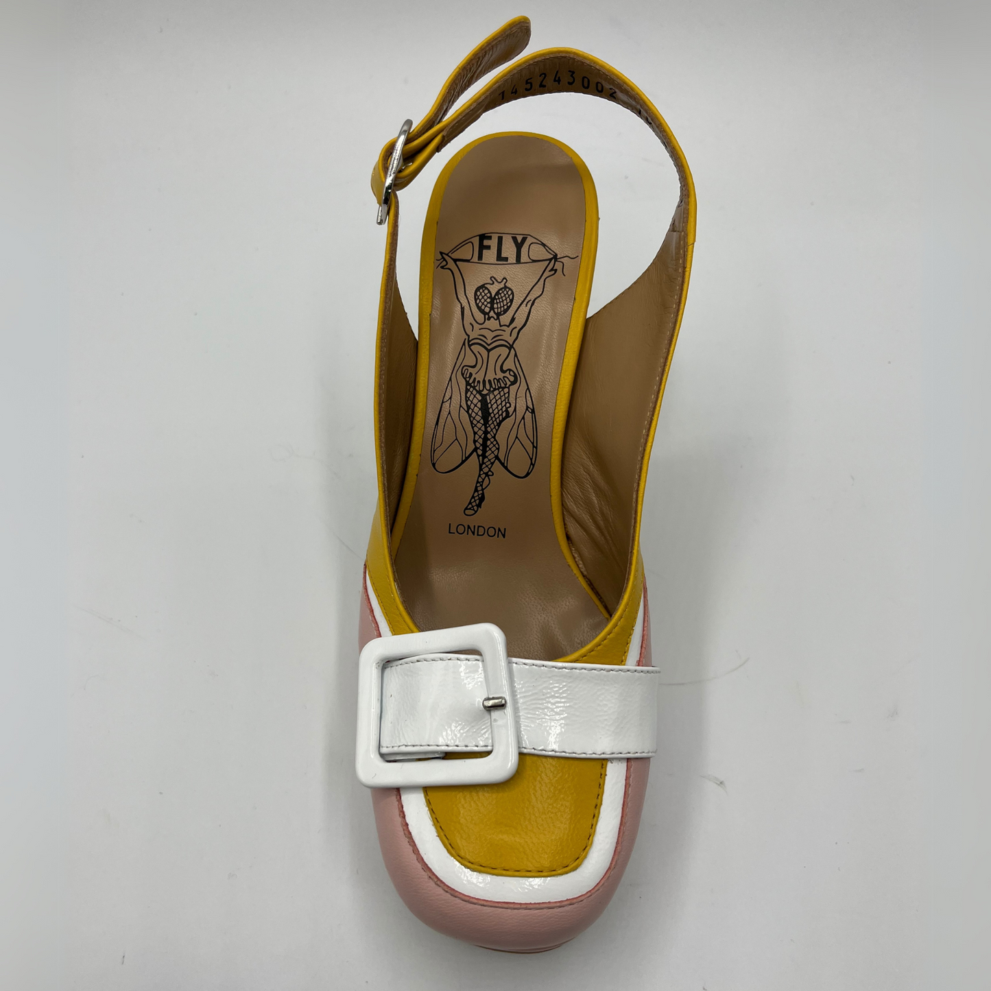 Top view of a yellow and pink high heeled shoe with a white buckle detail and an adjustable slingback strap.