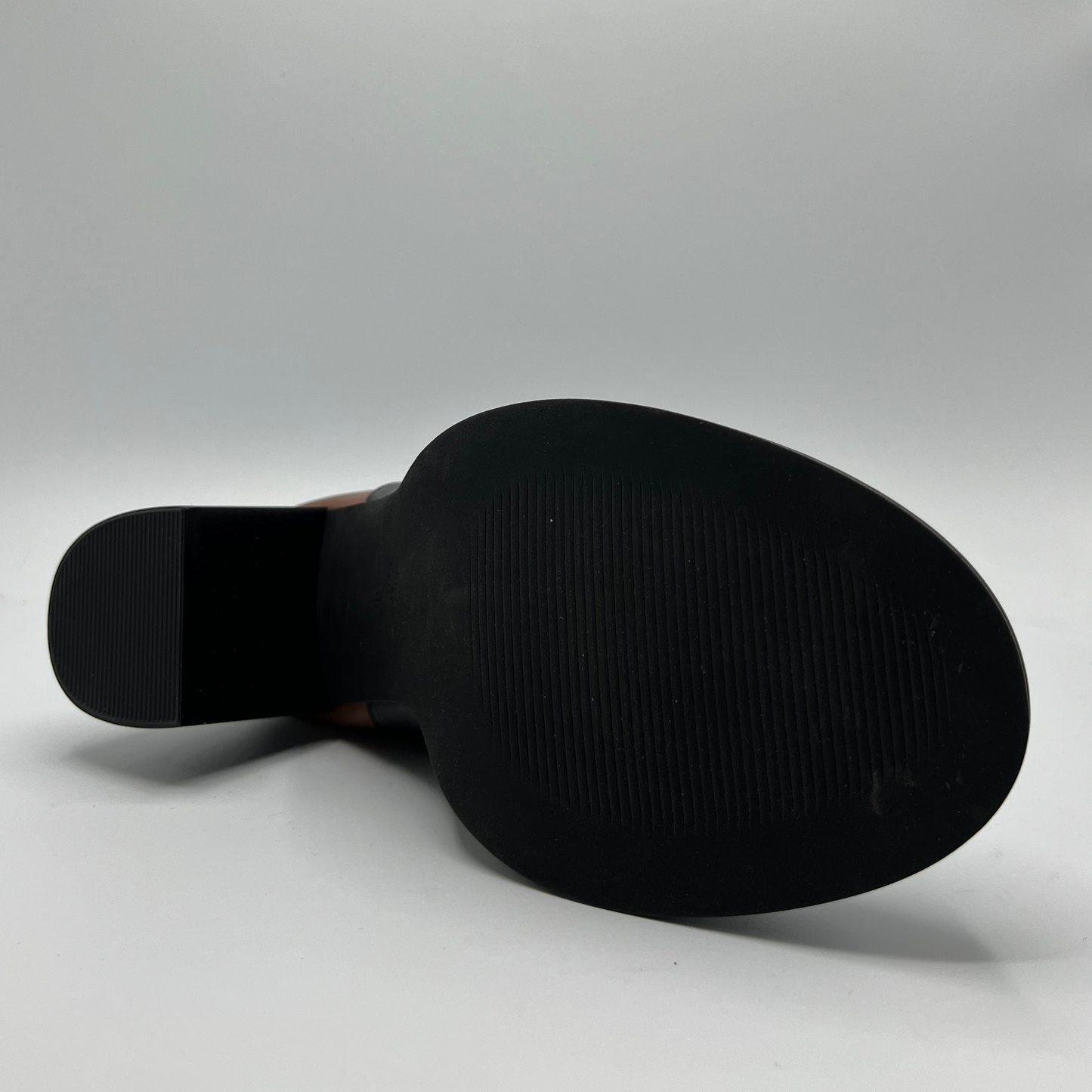 Black shoe sole on a gray background