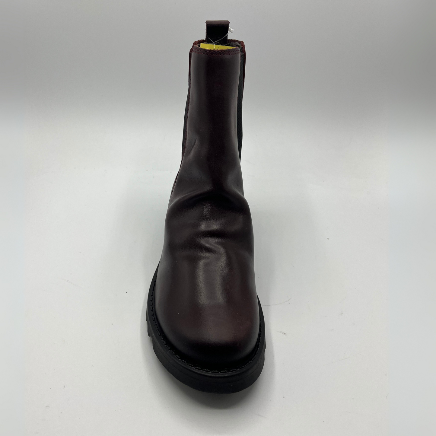 Wine leather boot on a white background