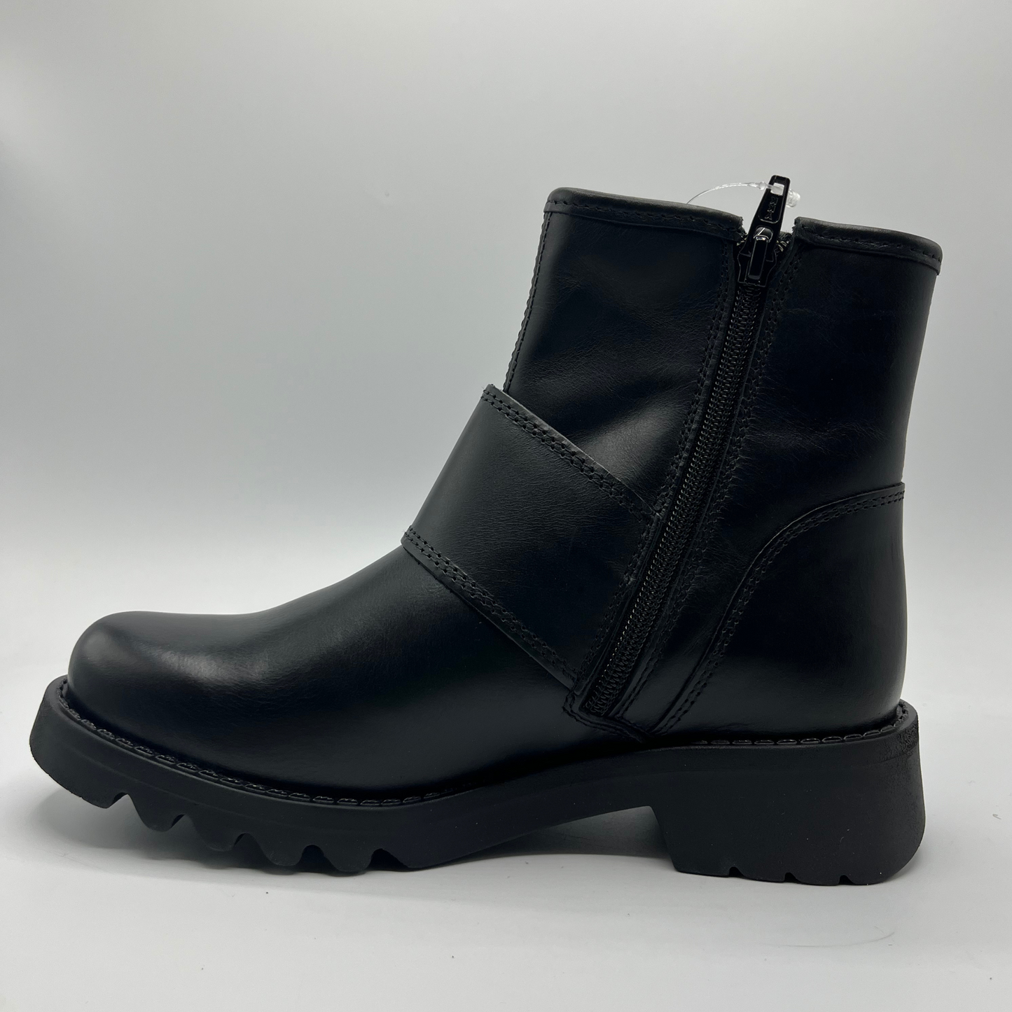 Black leather boot with a chunky sole on a white background