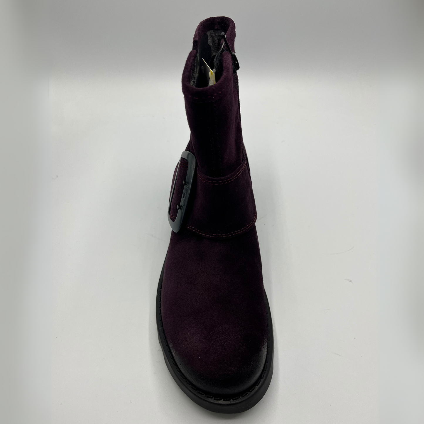 Purple boot with a strap on a white background