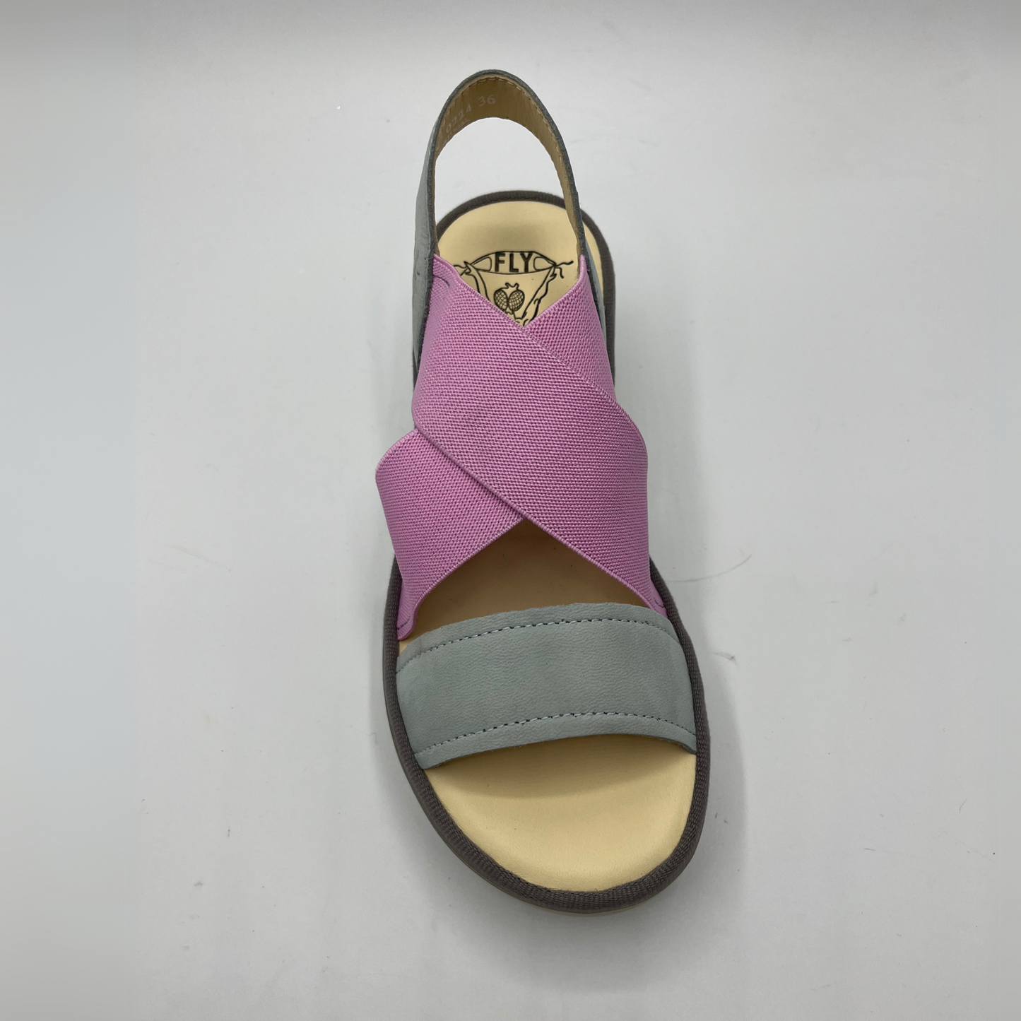 Top view of a stretchy pull on shoe with a leather sling back and toe strap. Featuring thick supportive platform sole