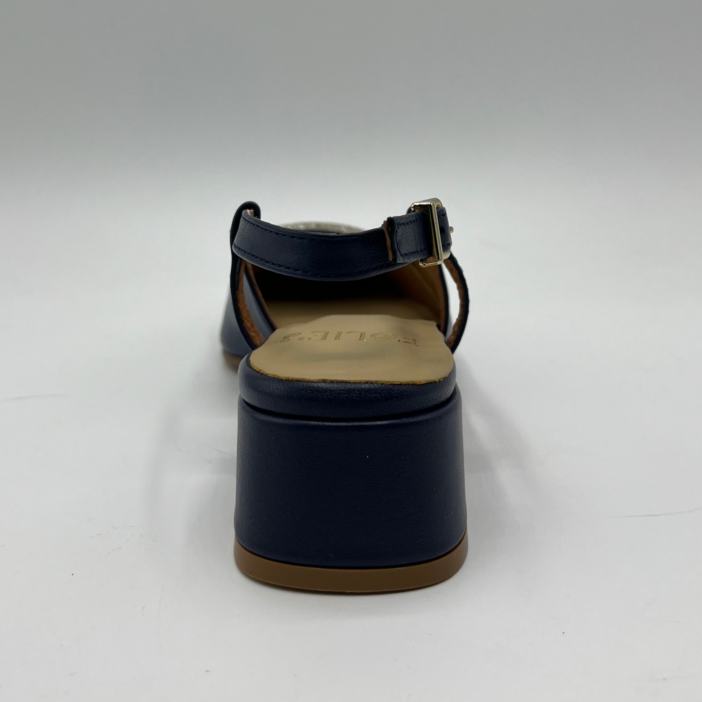 Back view of a navy leather slingback loafer with an adjustable buckle, wrapped heel and a squared toe.
