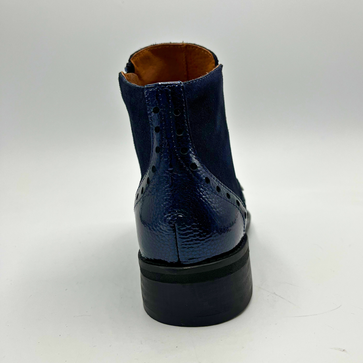 Blue leather boot on a white background