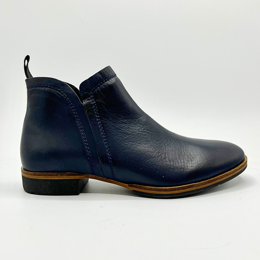 Navy blue leather ankle boot on a white background