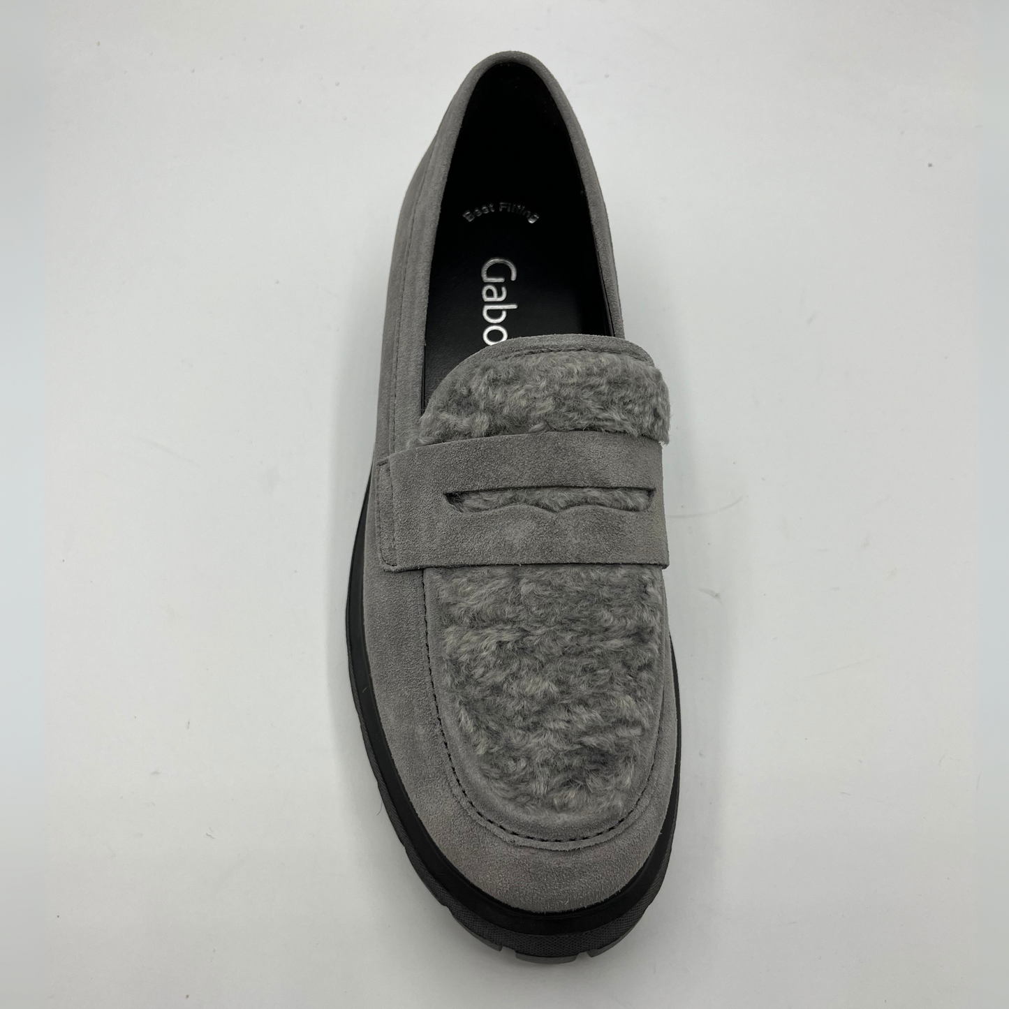 Gray suede loafer shoe on a white background
