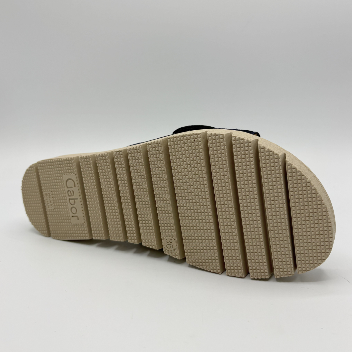 Close-up of a sandal sole with 'Gabor' branding on a white background