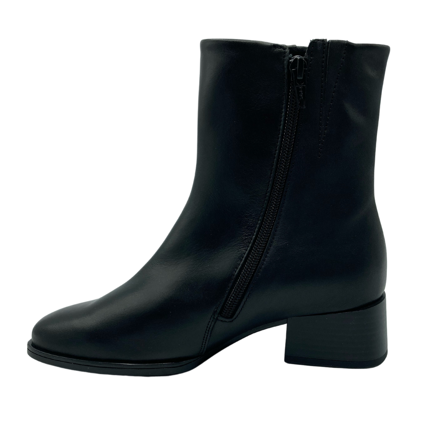 Left facing view of black leather short boot with side zipper closure and block heel