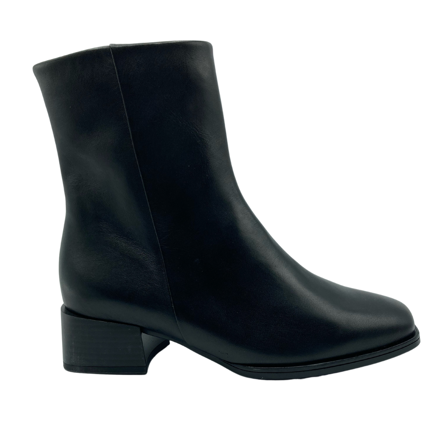 Right facing view of black leather boot with block heel and square toe