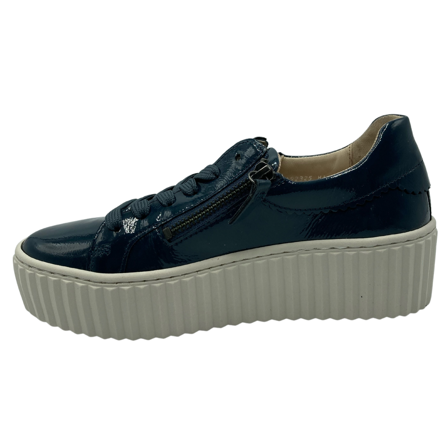 Left facing view of topaz patent leather sneaker with white rubber platform outsole