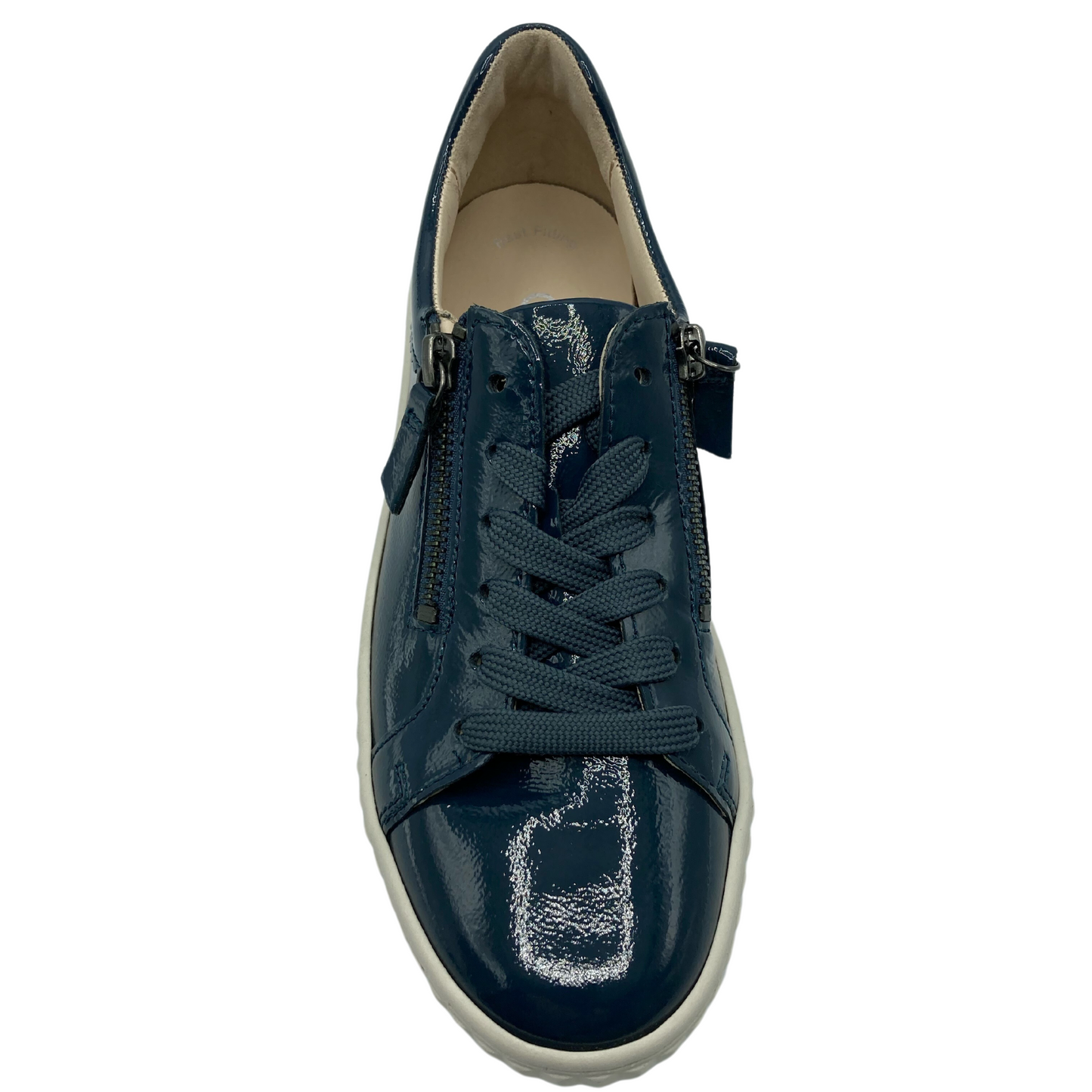 Top view of patent leather sneaker with side zipper closure and rounded toe