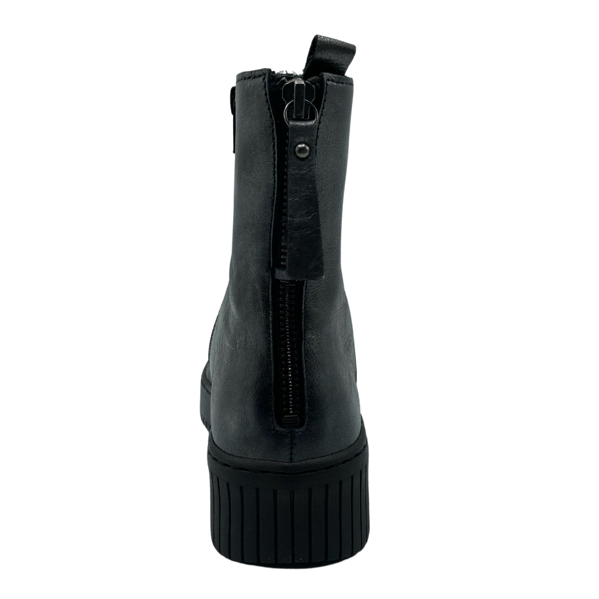 Back view of grey leather short boot with black outsole and back zipper closure