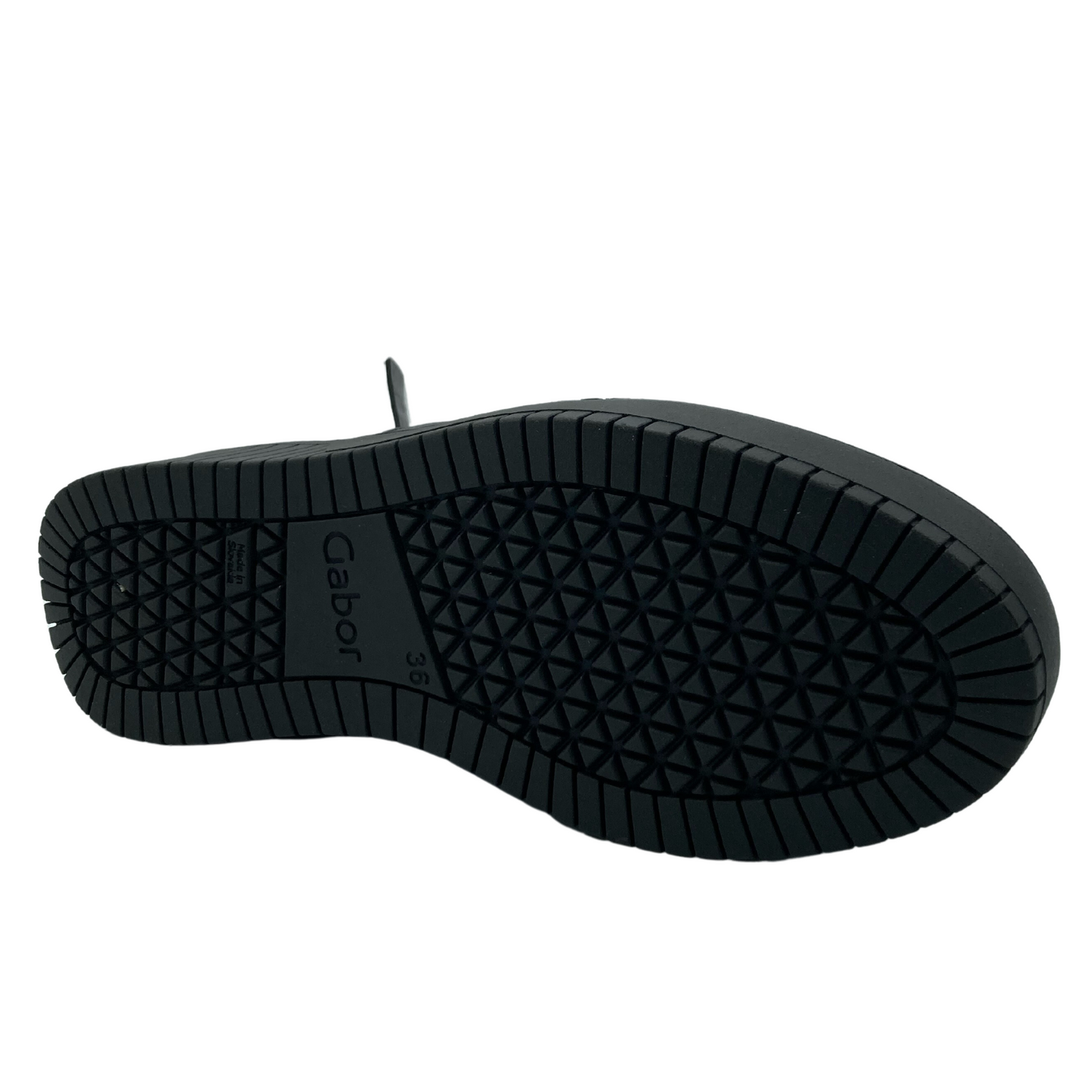 Bottom view of leather short boot with black rubber outsole