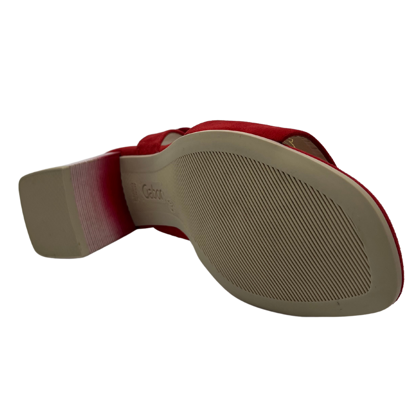 Bottom view of red high heeled sandal with soft square toe and silver buckle on the strap