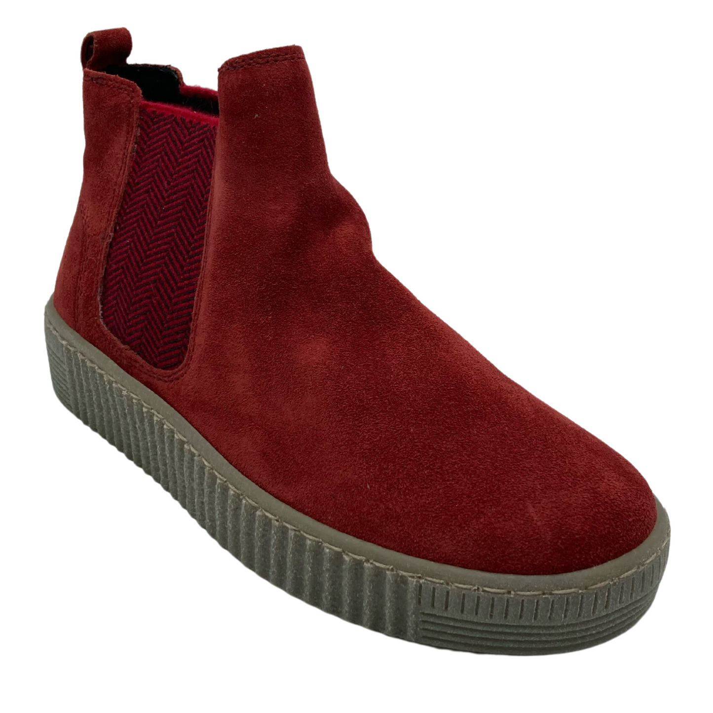 45 degree angled view of red short boot with taupe rubber sole