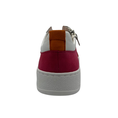 Back facing view of white, fuchsia and orange sneaker with white laces and rubber outsole.