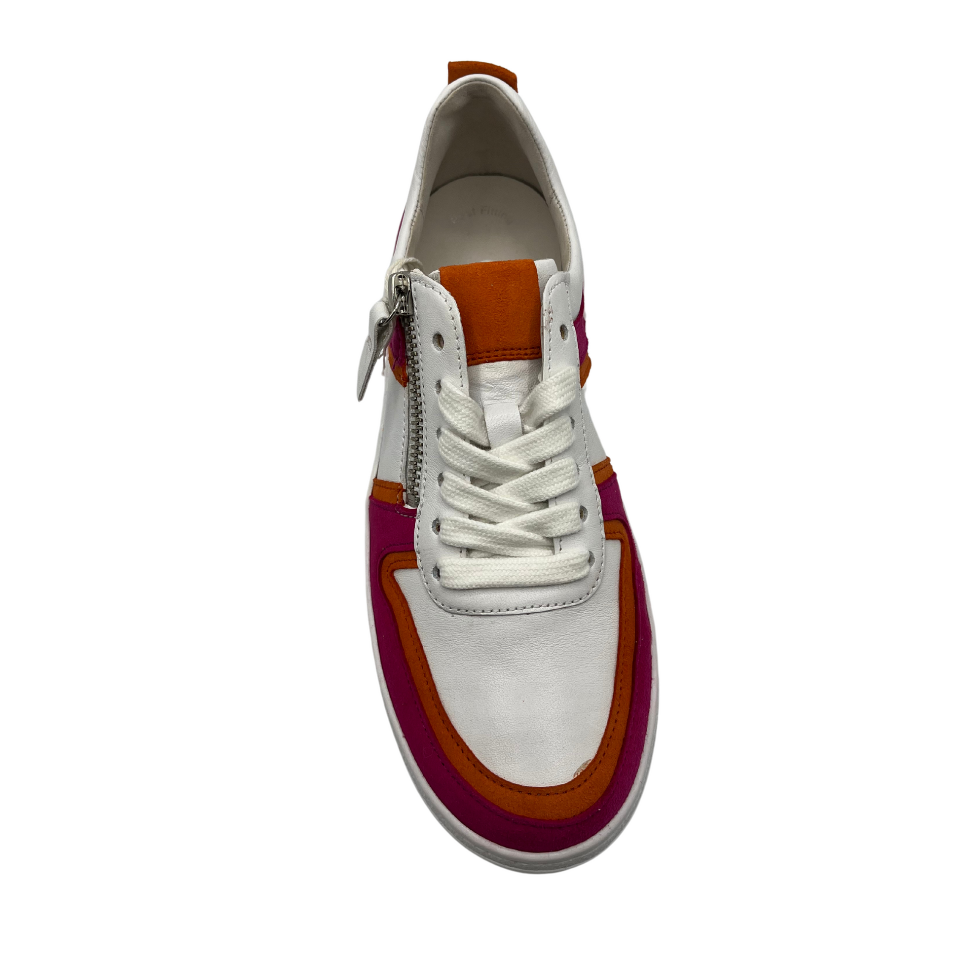 Top view of white, fuchsia and orange sneaker with white laces and rubber outsole.