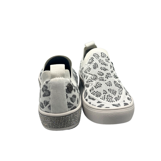 Front and rear view of a slip on style sneaker in a fun leopard print with silver crystal accents.  Shown in white