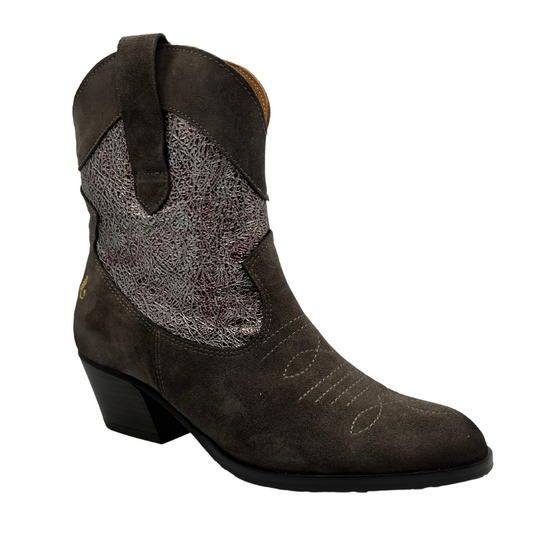 45 degree angled view of western style leather boot with pointed toe and short block heel.