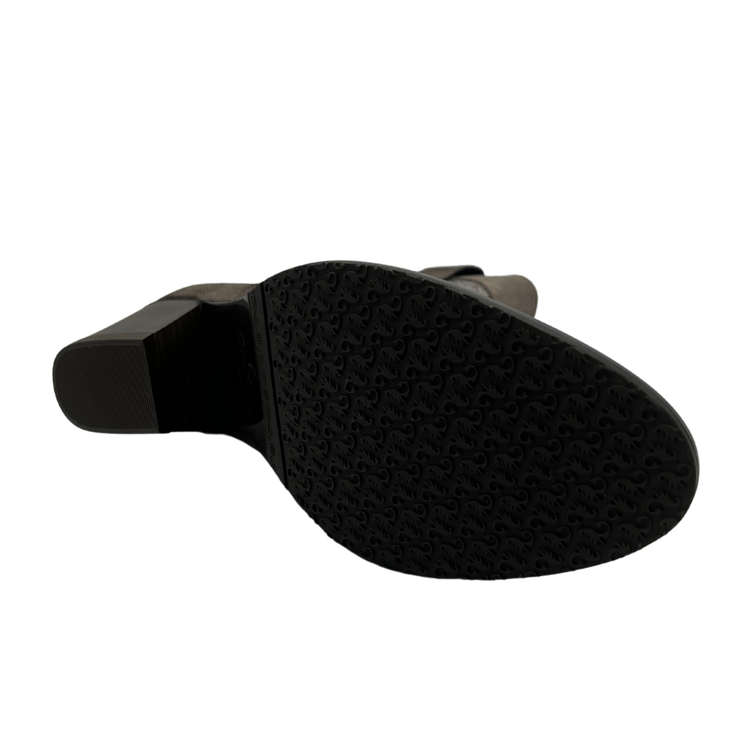 Bottom view of western style leather boot with pointed toe and short block heel.