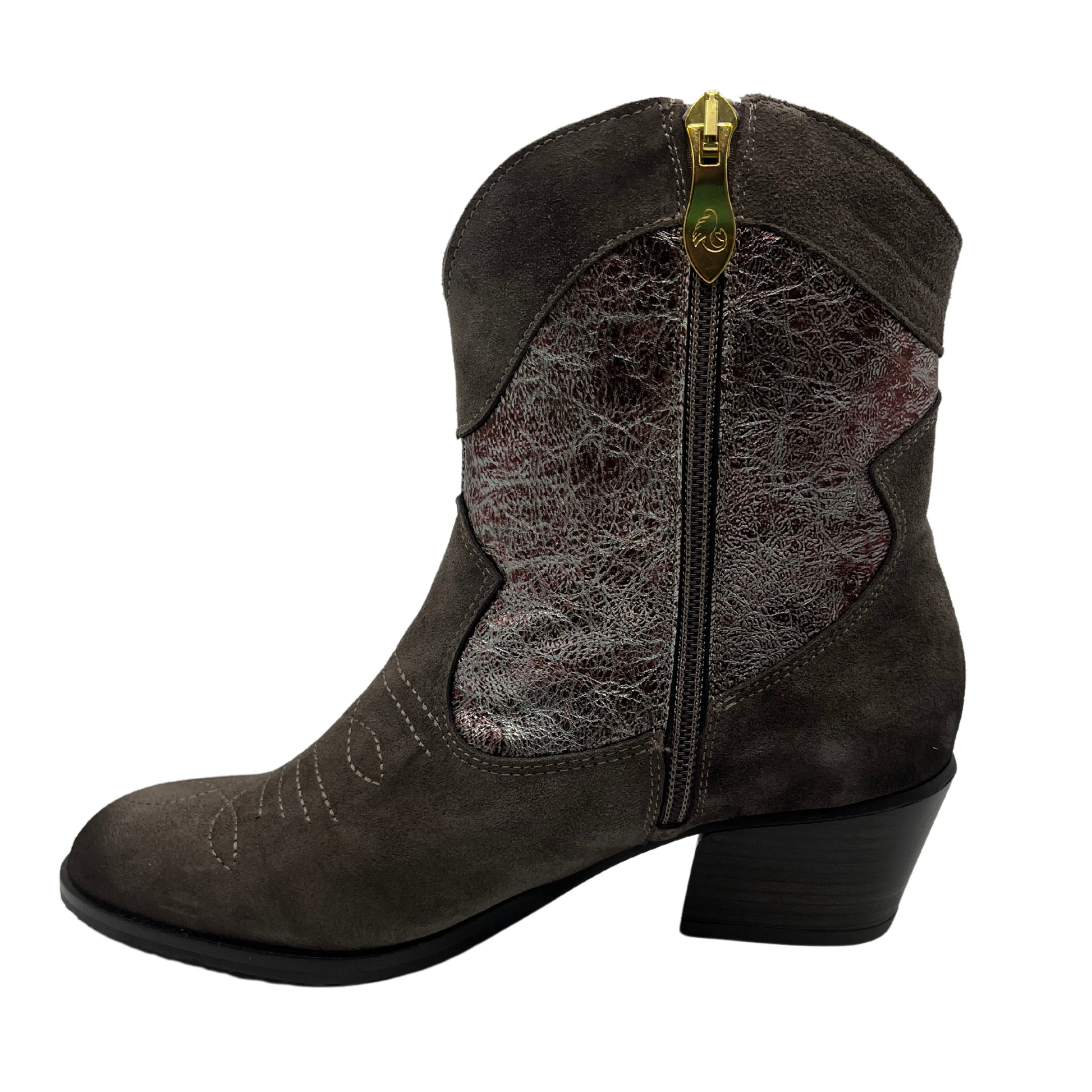 Left facing view of western style leather boot with pointed toe and short block heel.