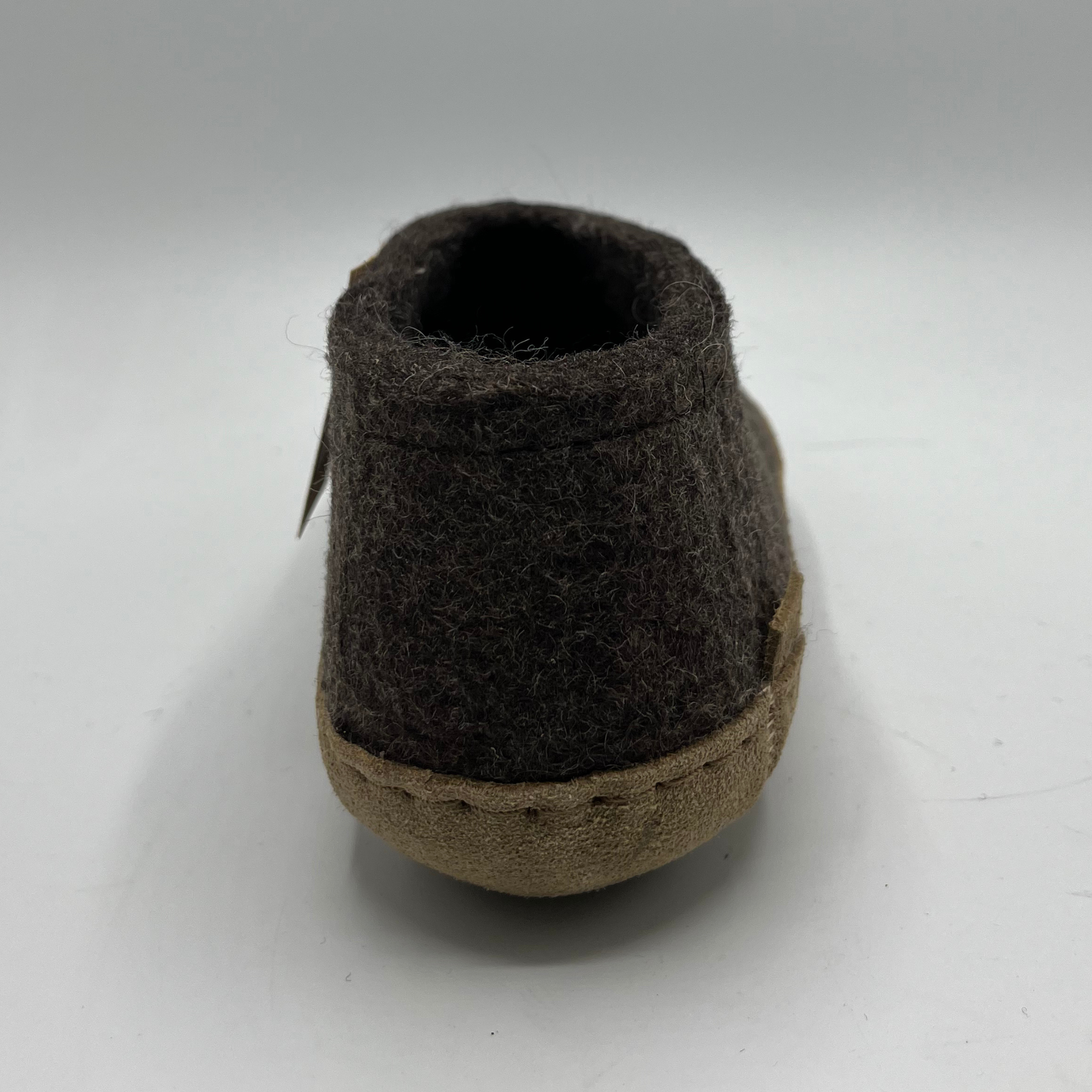Brown felted shoe on a white background