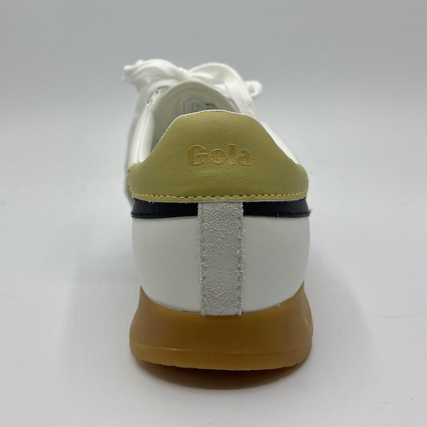 Back view of a leather sneaker with a brown rubber outsole and a lace up design.