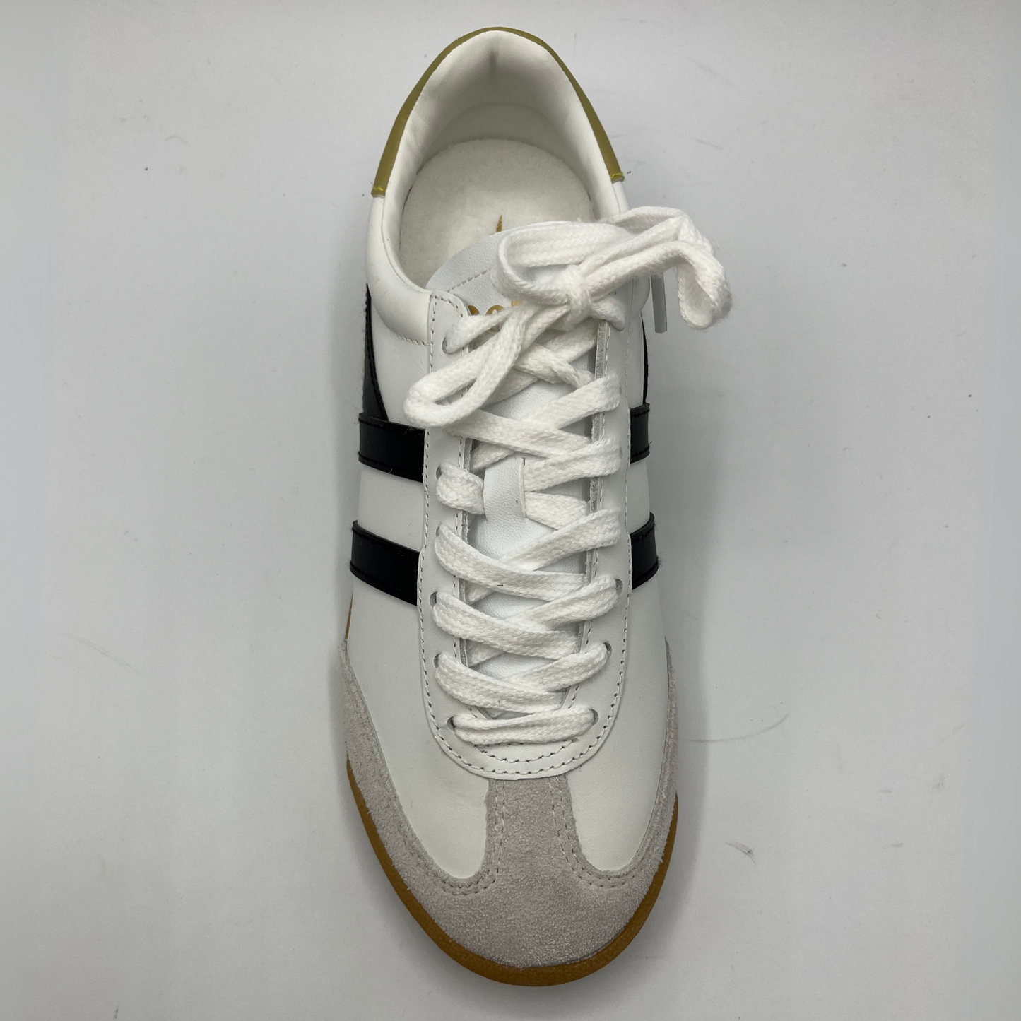 Top view of a leather sneaker with a brown rubber outsole and a lace up design.