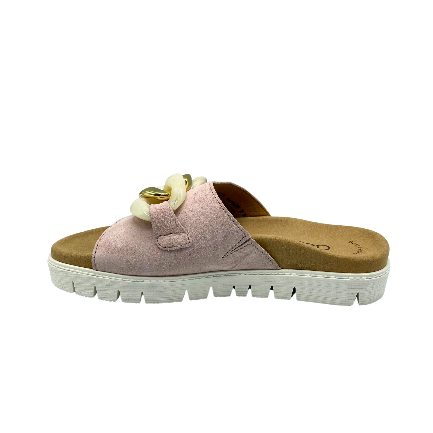 Inside view of a slide. Leather upper is a soft pink/nude color. Ergonomic footbed and white sole