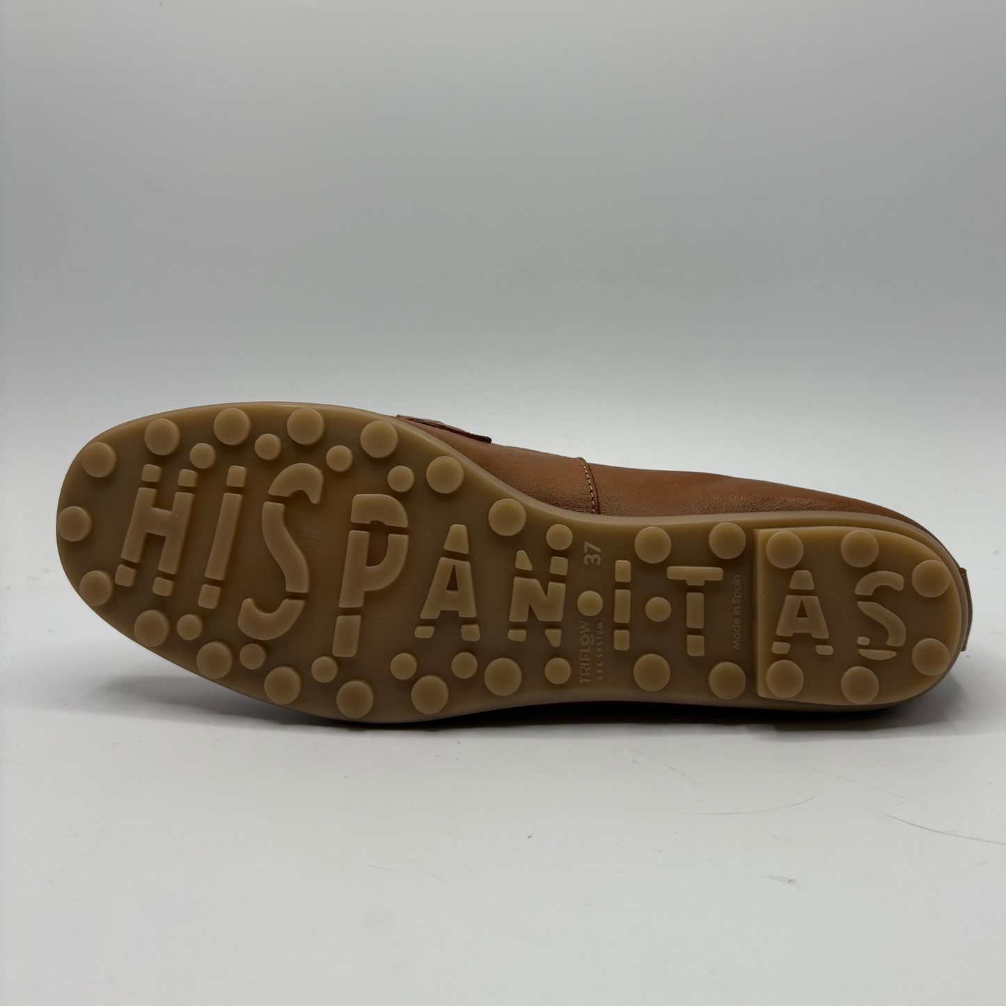Brown shoe sole with 'HISPANITAS' branding on a white background