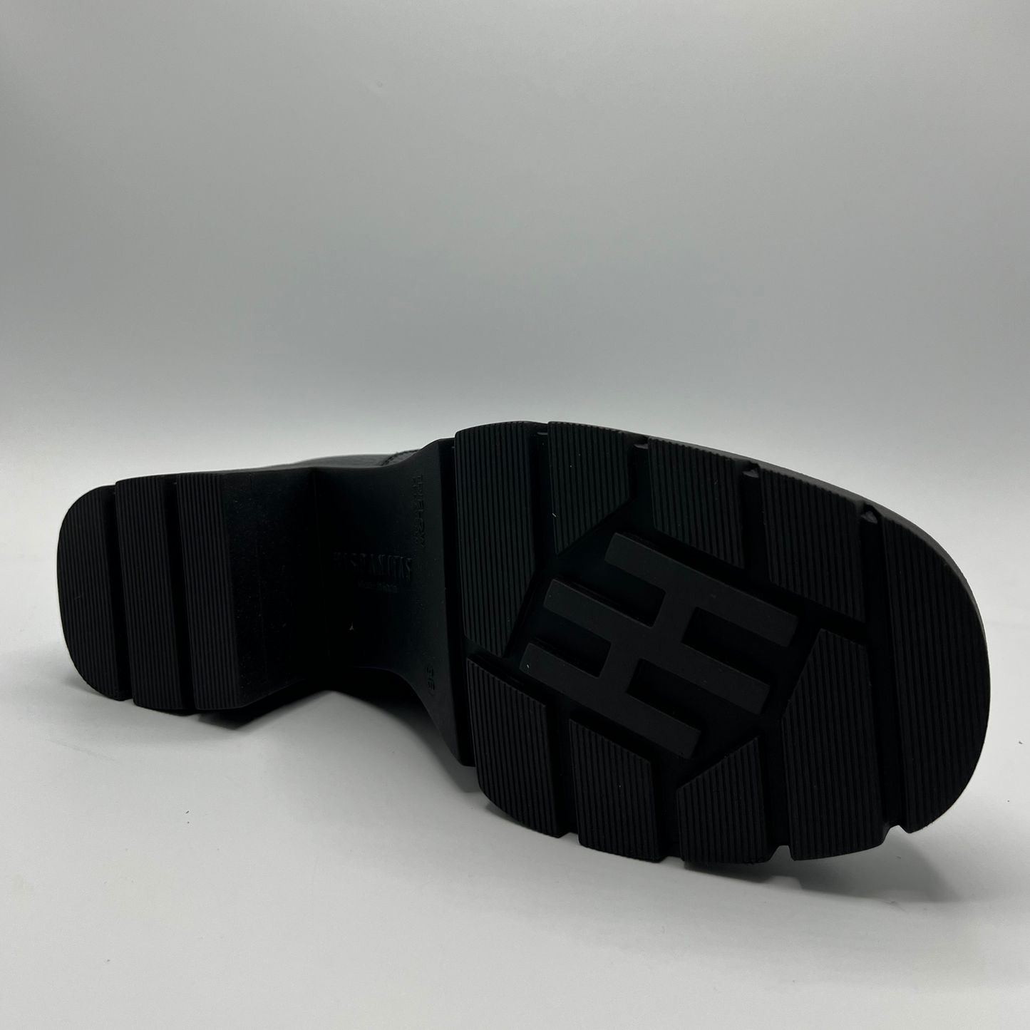 Black sole of a shoe on a white background