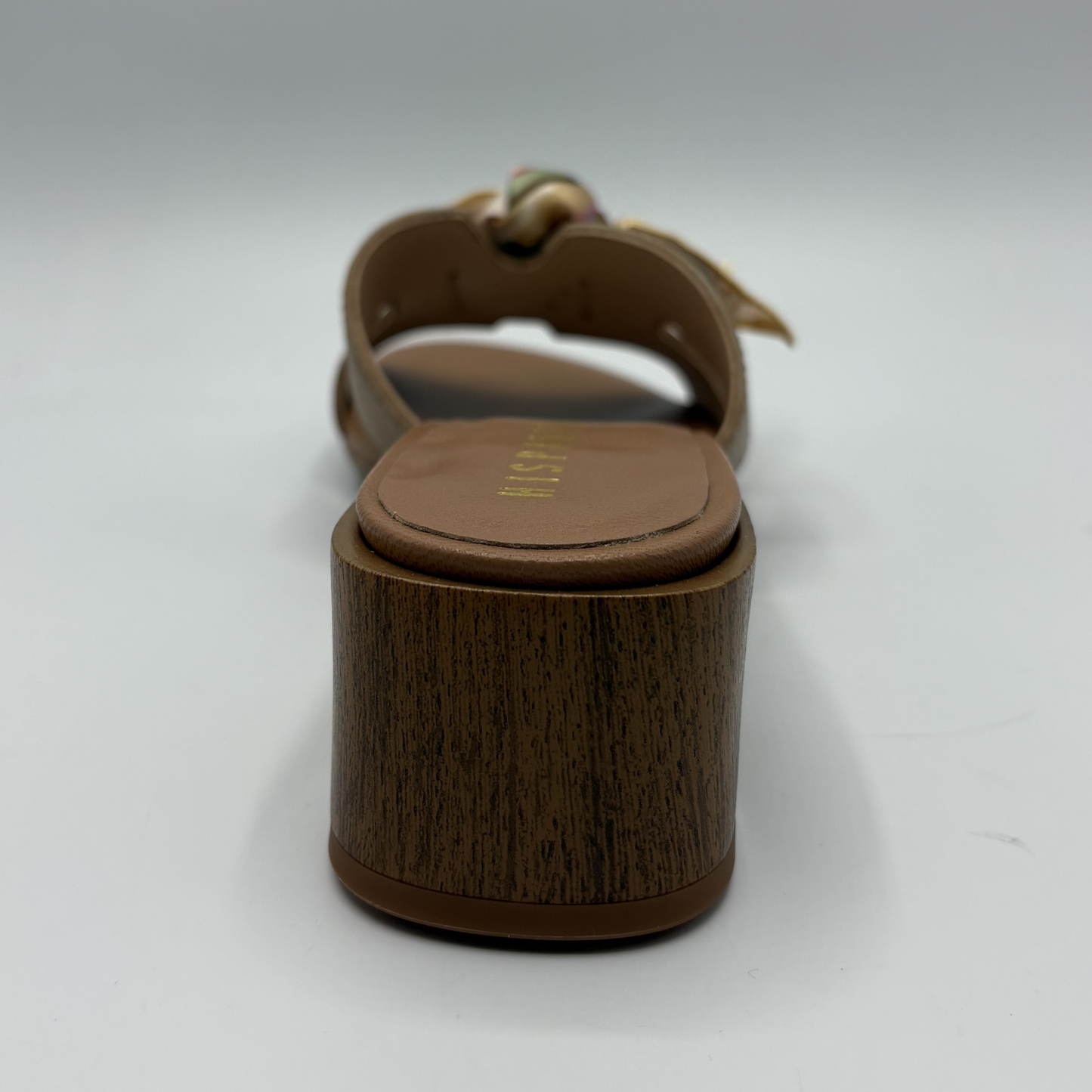 Brown sandal with wooden sole on a white background