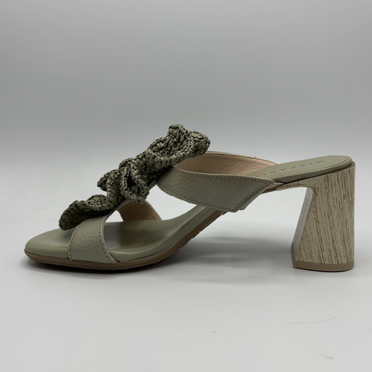 Green sandal with wooden heel on a gray background