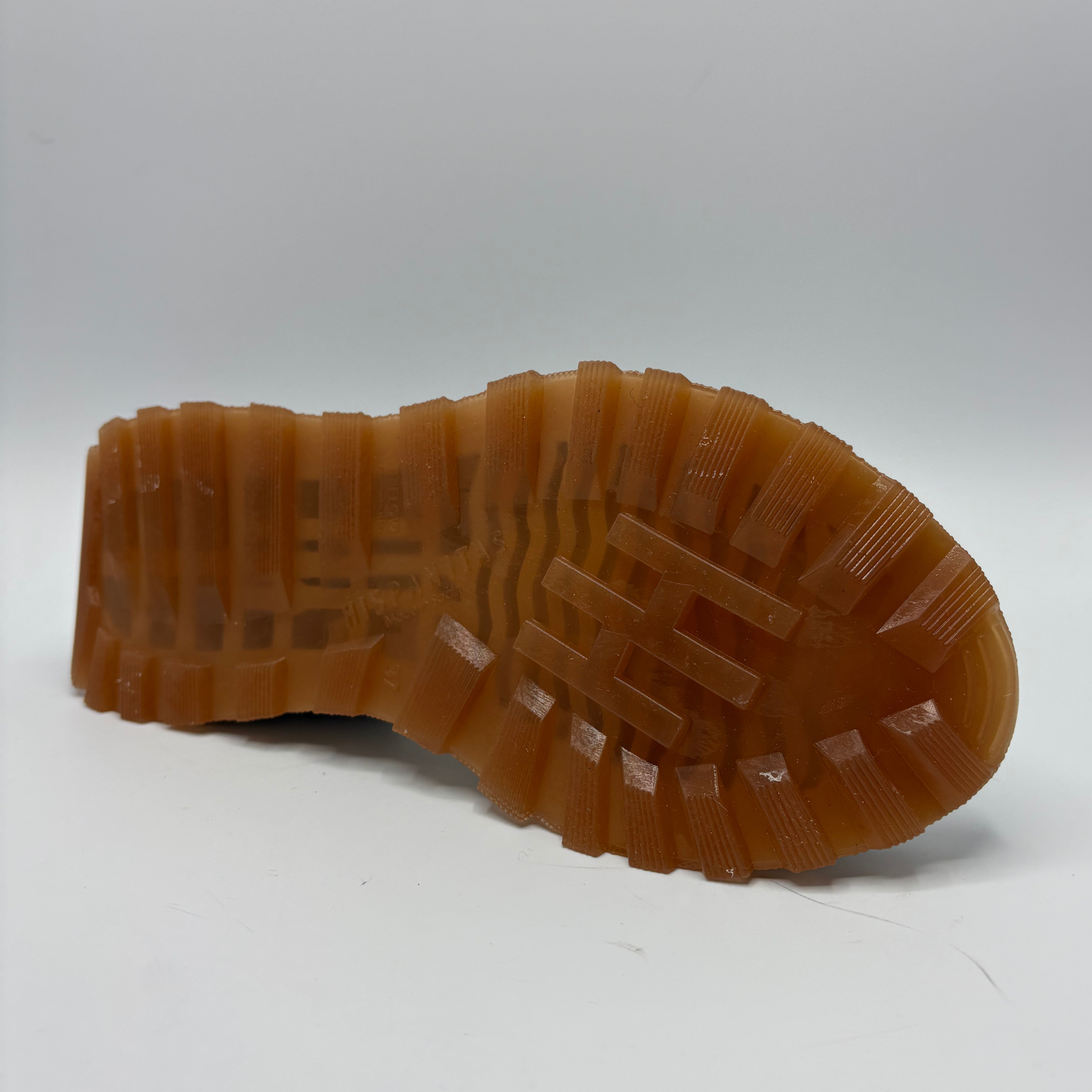 Brown sole of a shoe on a white background