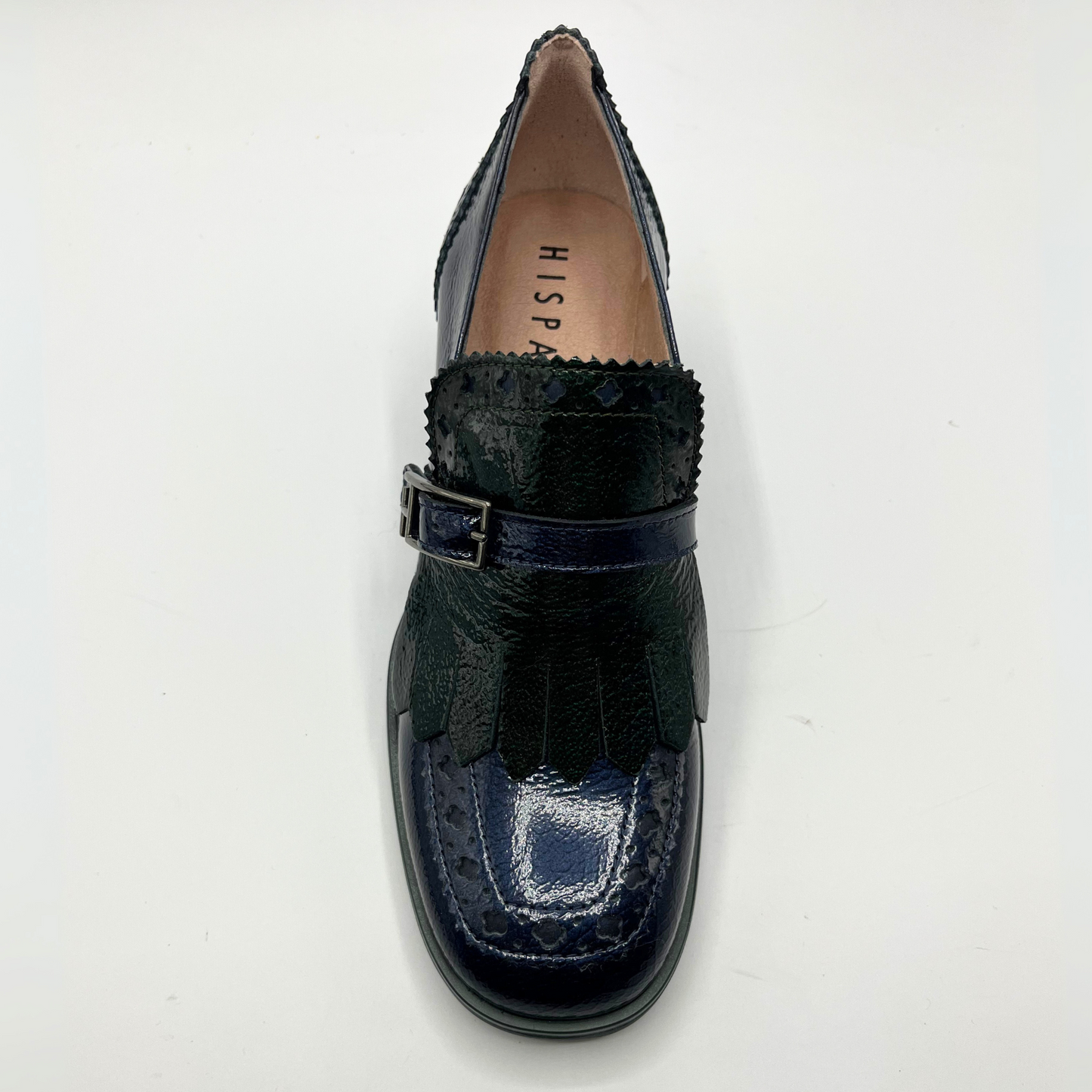 Navy blue loafer shoe with a buckle on a white background