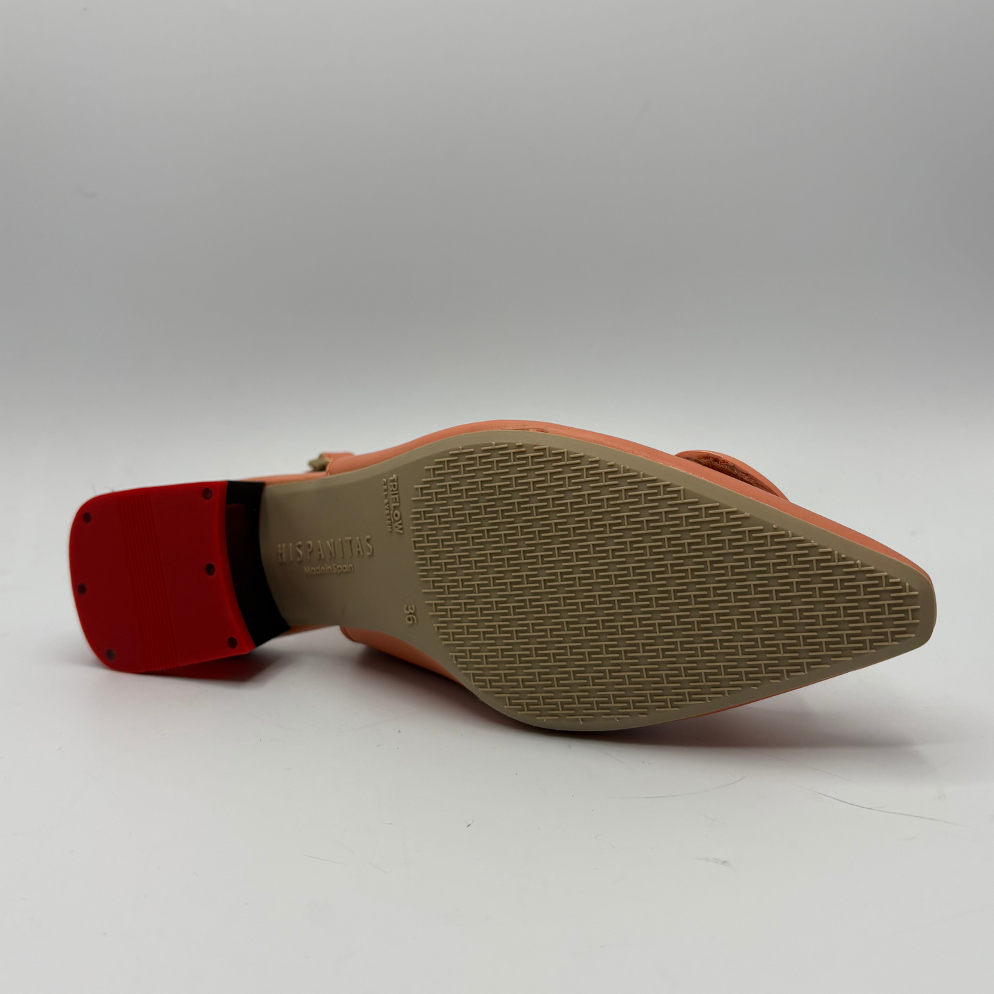 Close-up of a shoe sole with red insole on a white background