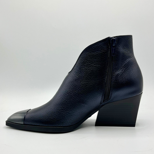 Navy leather ankle boot on a white background