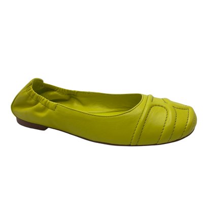45 degree angled view of lime leather ballet flats with a rounded toe and elasticated back