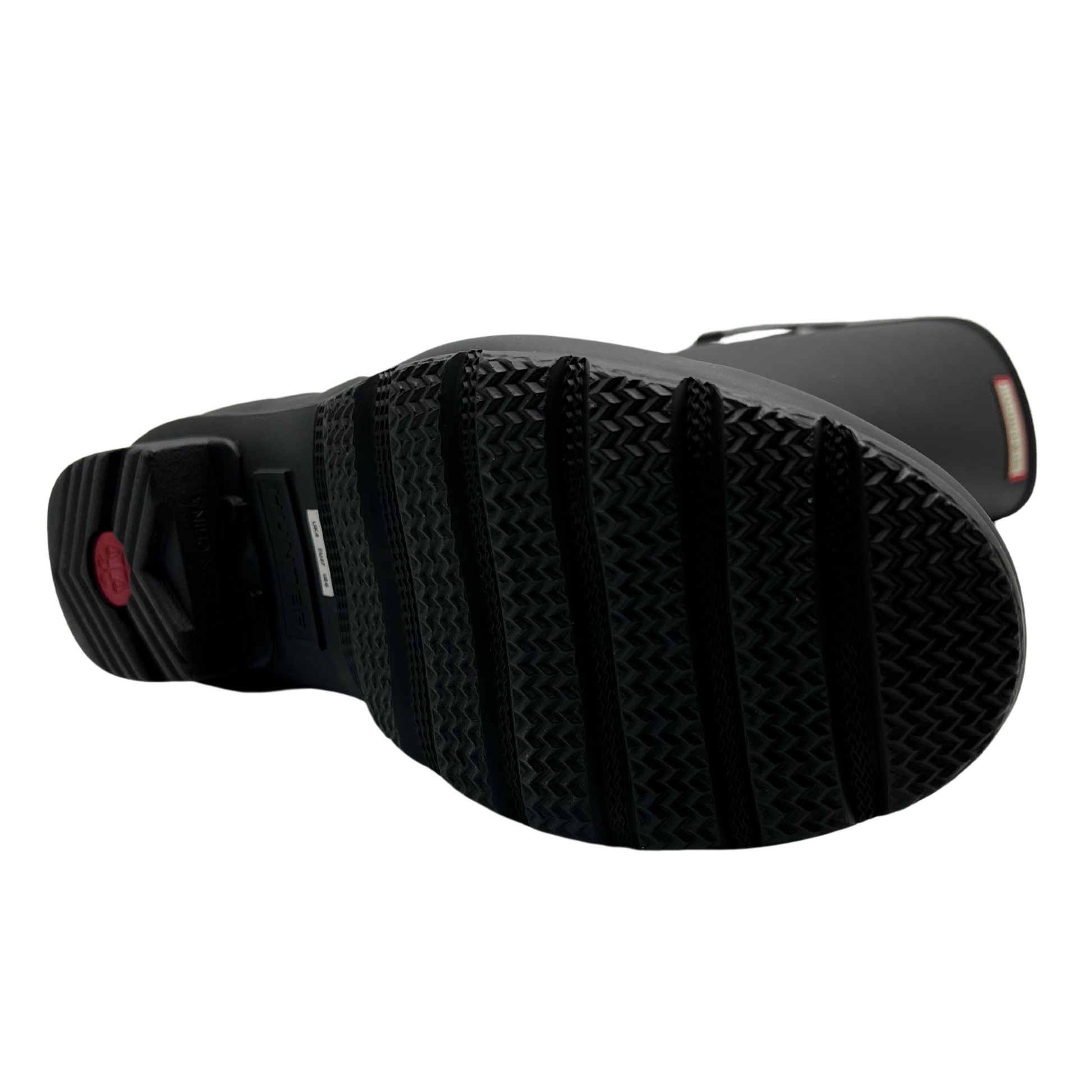 Bottom view of black waterproof tall boot with adjustable calf strap and low heel.